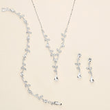 a necklace and earring set is shown on a white surface