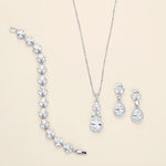 a necklace, earrings, and ring on a white background