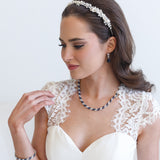a woman wearing a white dress and a necklace