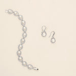 a diamond and pearl necklace and earring set