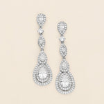 a pair of diamond earrings on a white background