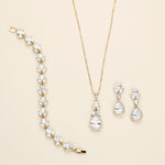 a necklace, bracelet, and earrings are shown on a white surface