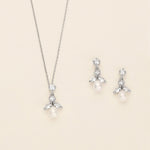 a necklace and earring set with pearls