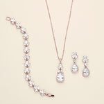 a necklace, bracelet, and earrings on a white background