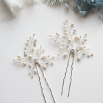 a couple of pins sitting on top of a table