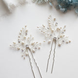 a couple of pins sitting on top of a table