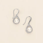 a pair of pearl and diamond earrings