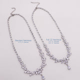 a necklace with a cross on it is shown