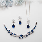 a necklace and earring set with blue stones