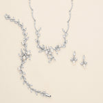 a necklace and earring set with pearls