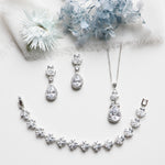 a necklace, earrings, and a bouquet of flowers