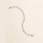 a white pearl necklace with a silver clasp