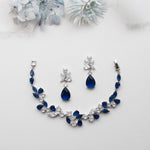 a necklace and earring set with blue stones
