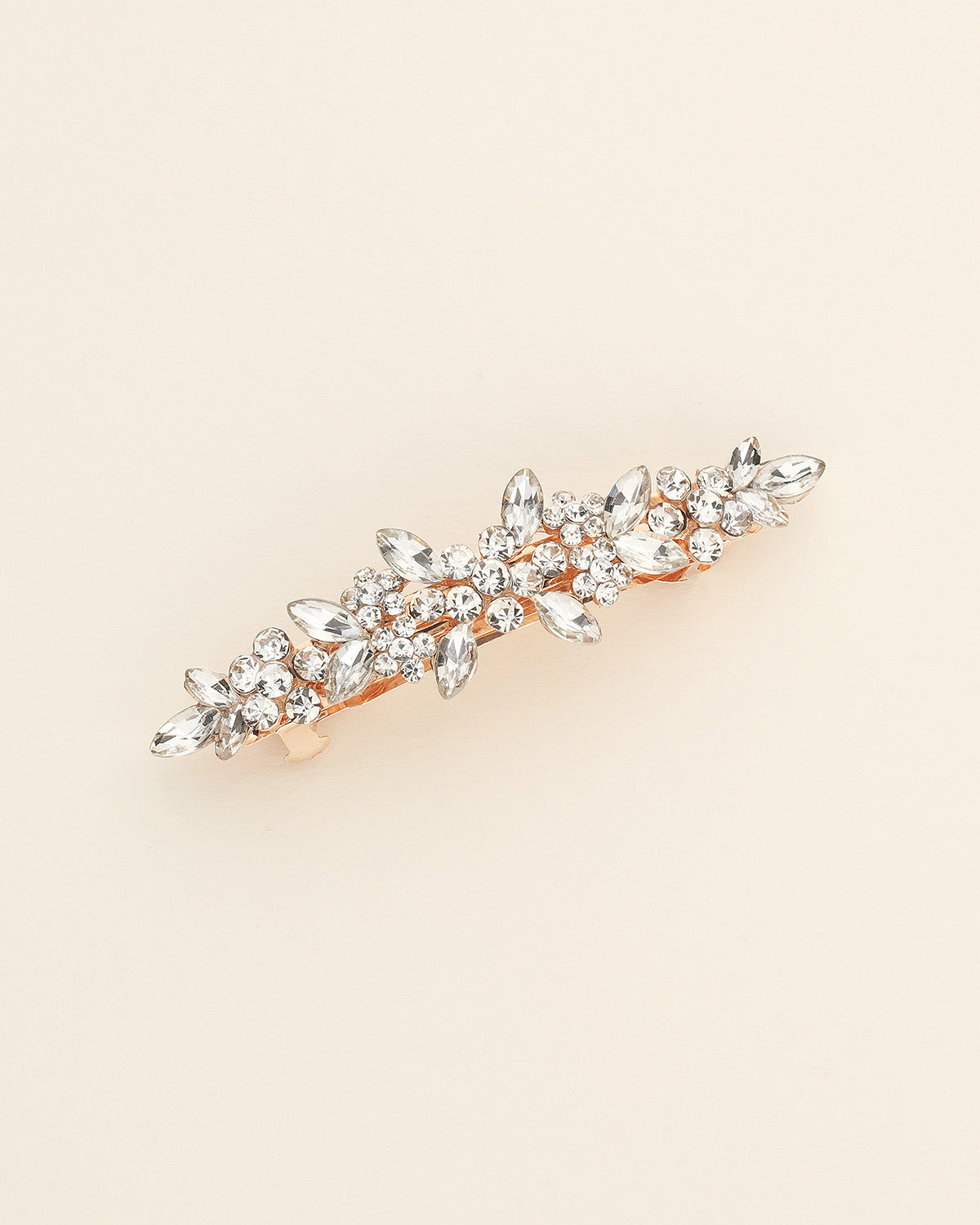 a gold brooch with a bunch of crystal stones