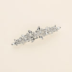 a close up of a brooch on a white background