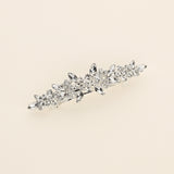 a close up of a brooch on a white background
