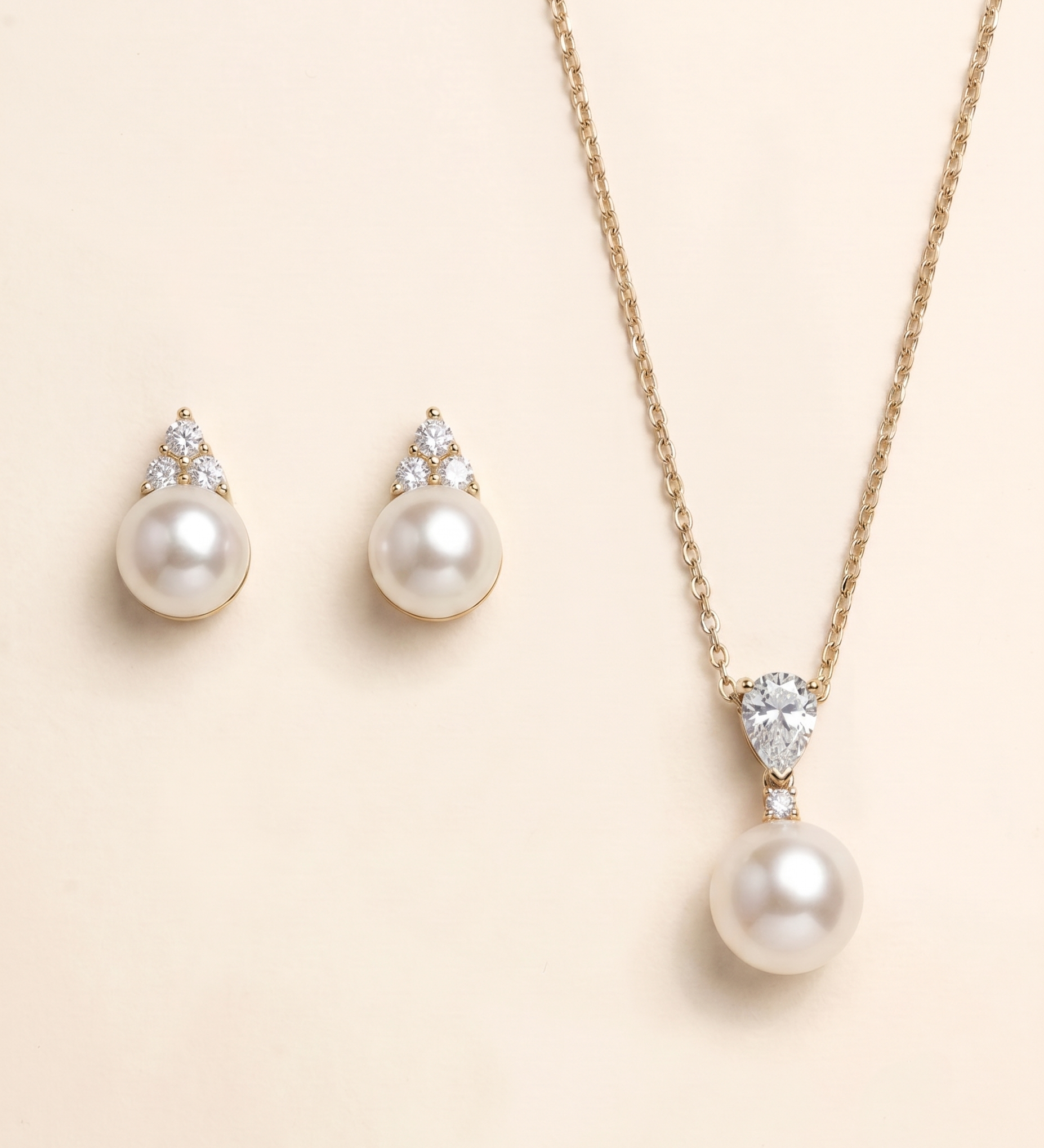 A necklace with a pendant and earrings made of pearls and diamonds.