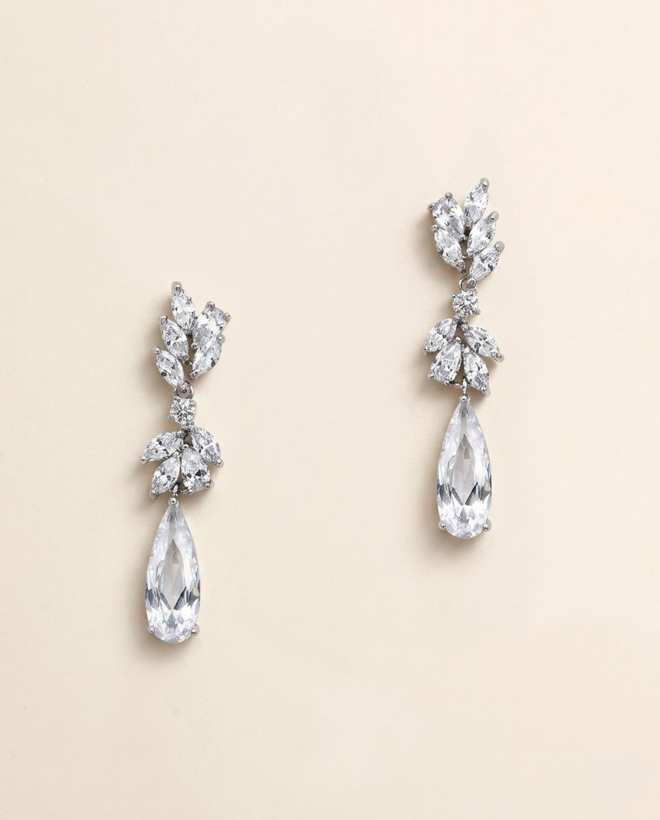 A pair of elegant earrings with large, clear gemstones hanging from the bottom.