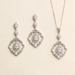 a set of elegant jewelry pieces, including earrings and a necklace, both adorned with sparkling diamonds.