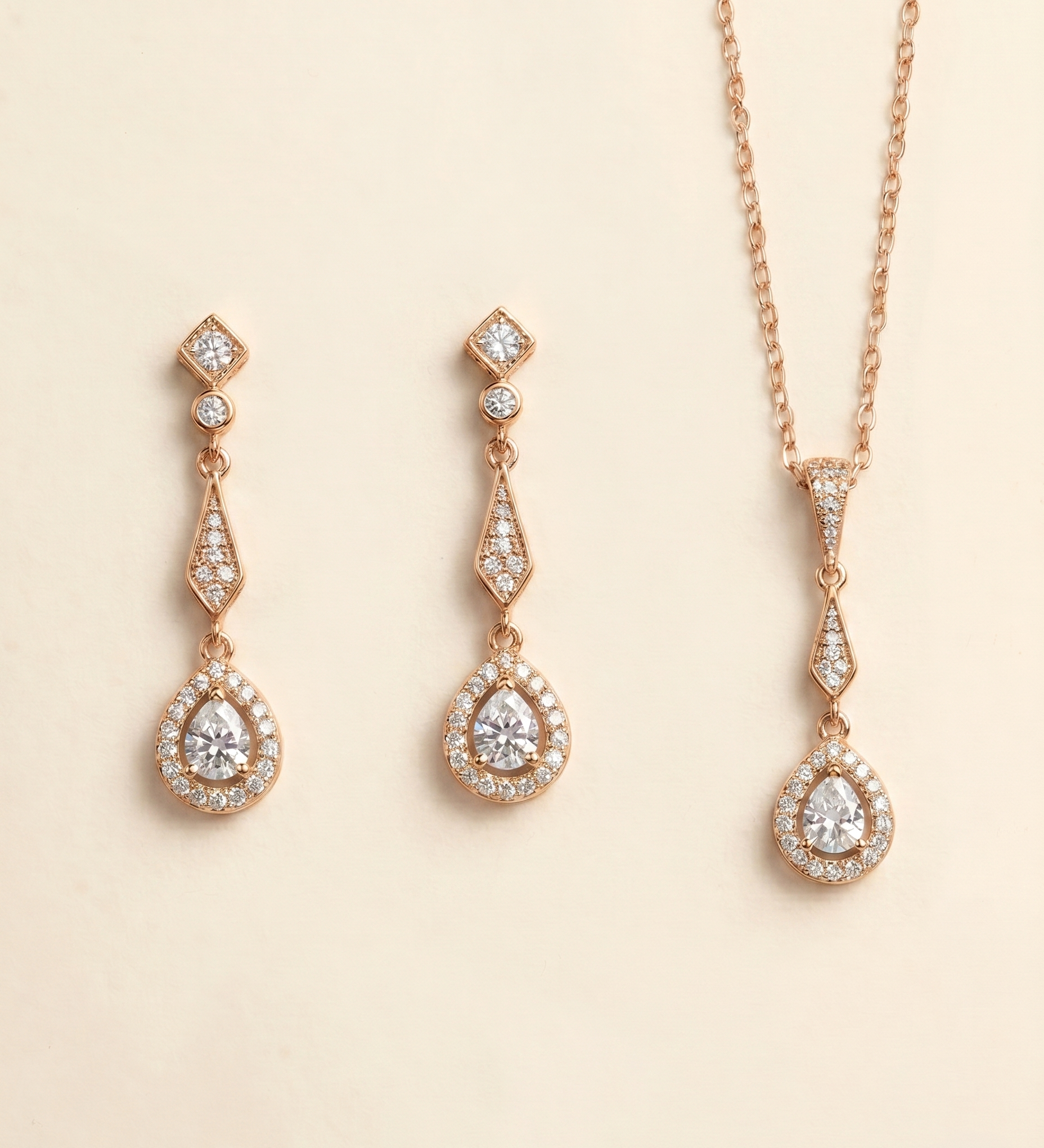 a set of elegant gold jewelry pieces, including earrings and a necklace, adorned with sparkling diamonds.