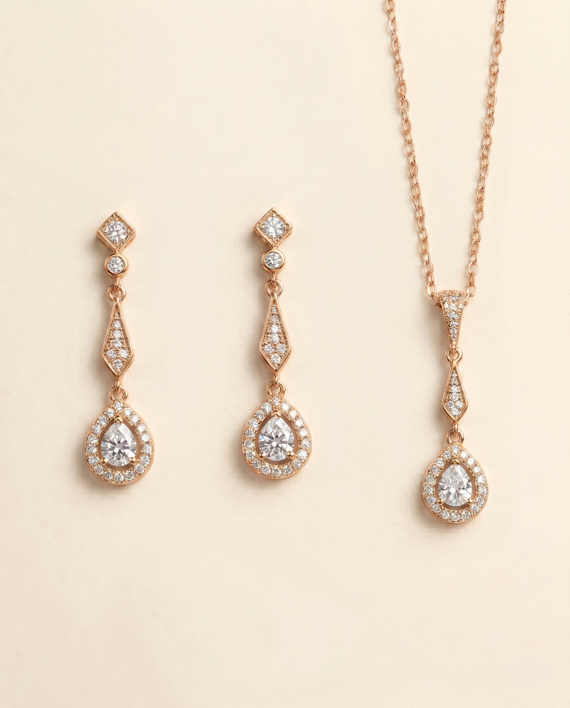 a set of elegant gold jewelry pieces, including earrings and a necklace, adorned with sparkling diamonds.