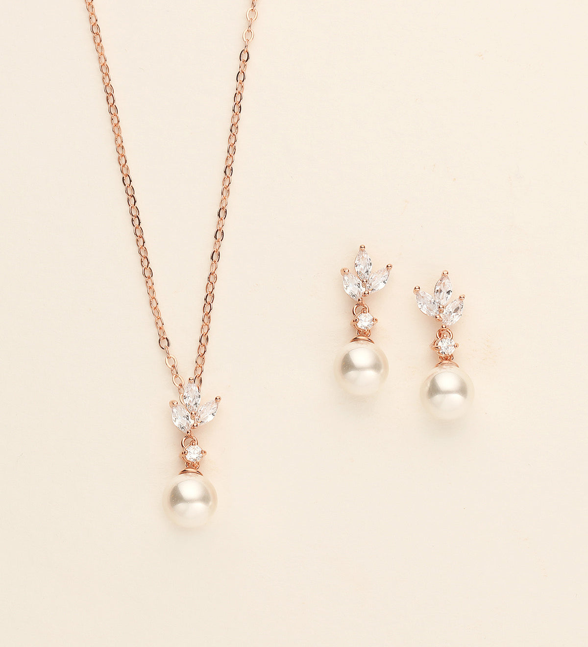 a necklace and earring set with pearls