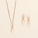 a necklace and earring set with pearls