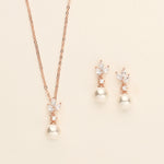 a necklace and earring set with pearls