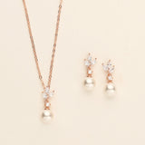 a necklace and earring set with pearls