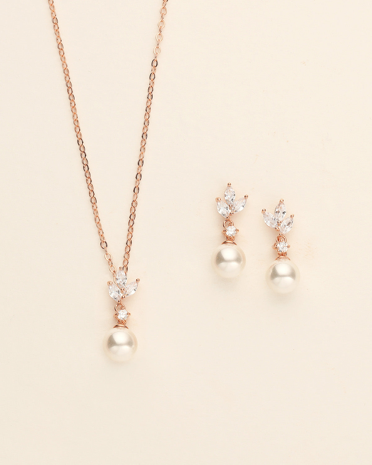 a necklace and earring set with pearls