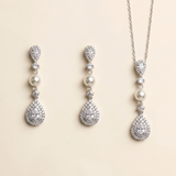 A set of elegant jewelry pieces, including earrings and a necklace, featuring a combination of pearls, diamonds, and gemstones.