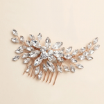 A decorative hair accessory with a floral design and numerous clear gemstones.