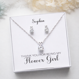 A necklace and earrings set presented in a white box with a personalized message.