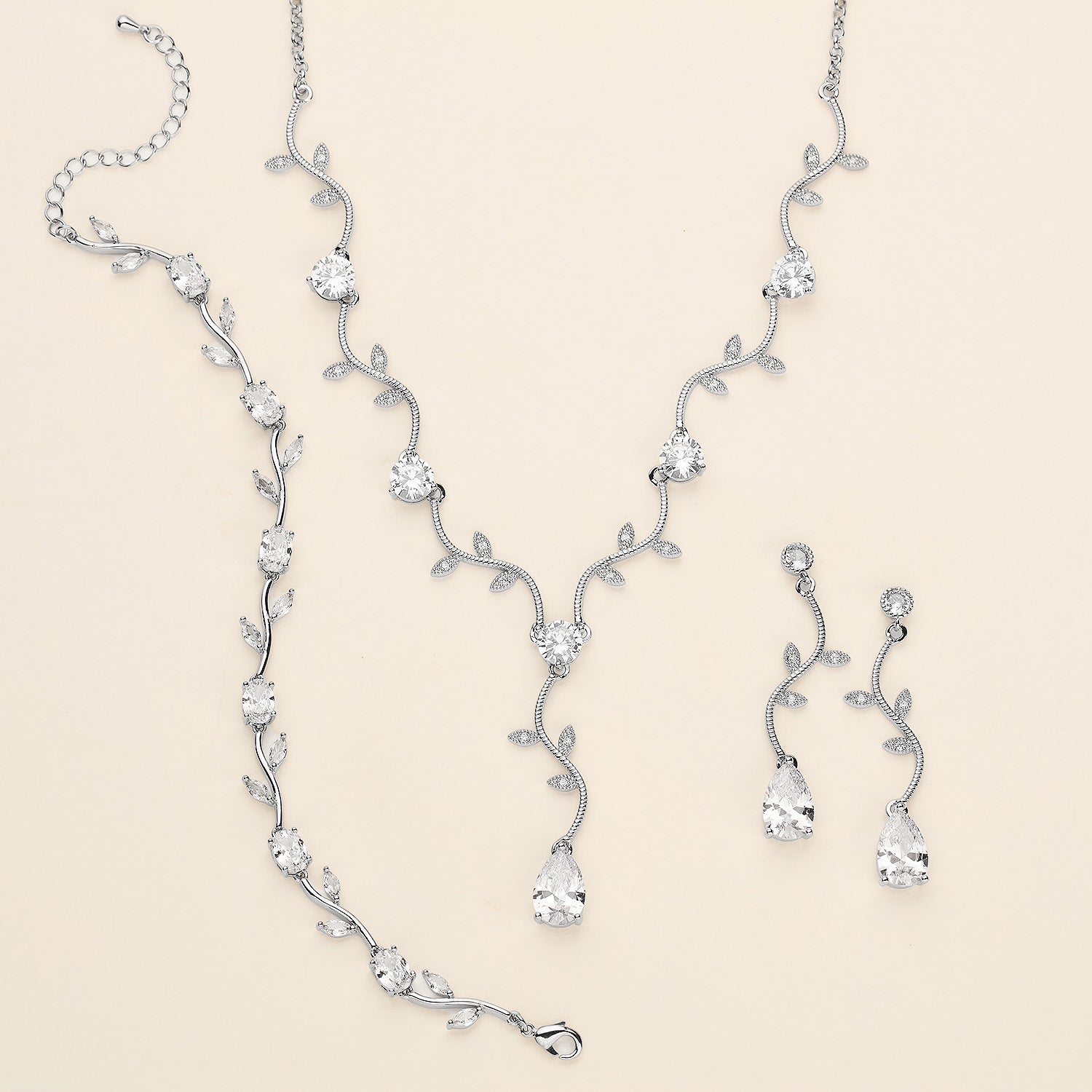 a necklace and earring set with a diamond