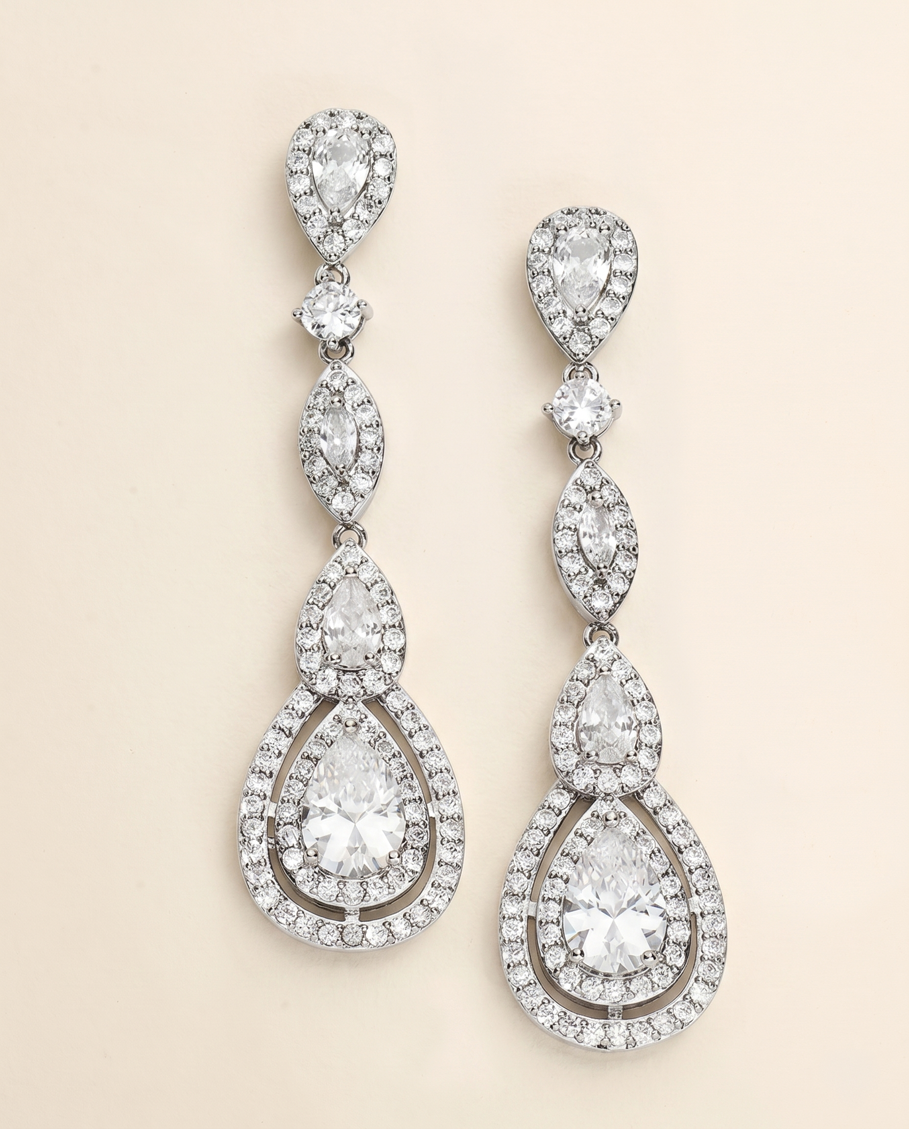 A pair of elegant diamond earrings with multiple tiers of sparkling crystal stones.