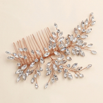 a decorative hair accessory with a metallic copper-colored frame and a branch-like design adorned with numerous small, clear crystal embellishments.