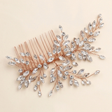 a decorative hair accessory with a metallic copper-colored frame and a branch-like design adorned with numerous small, clear crystal embellishments.