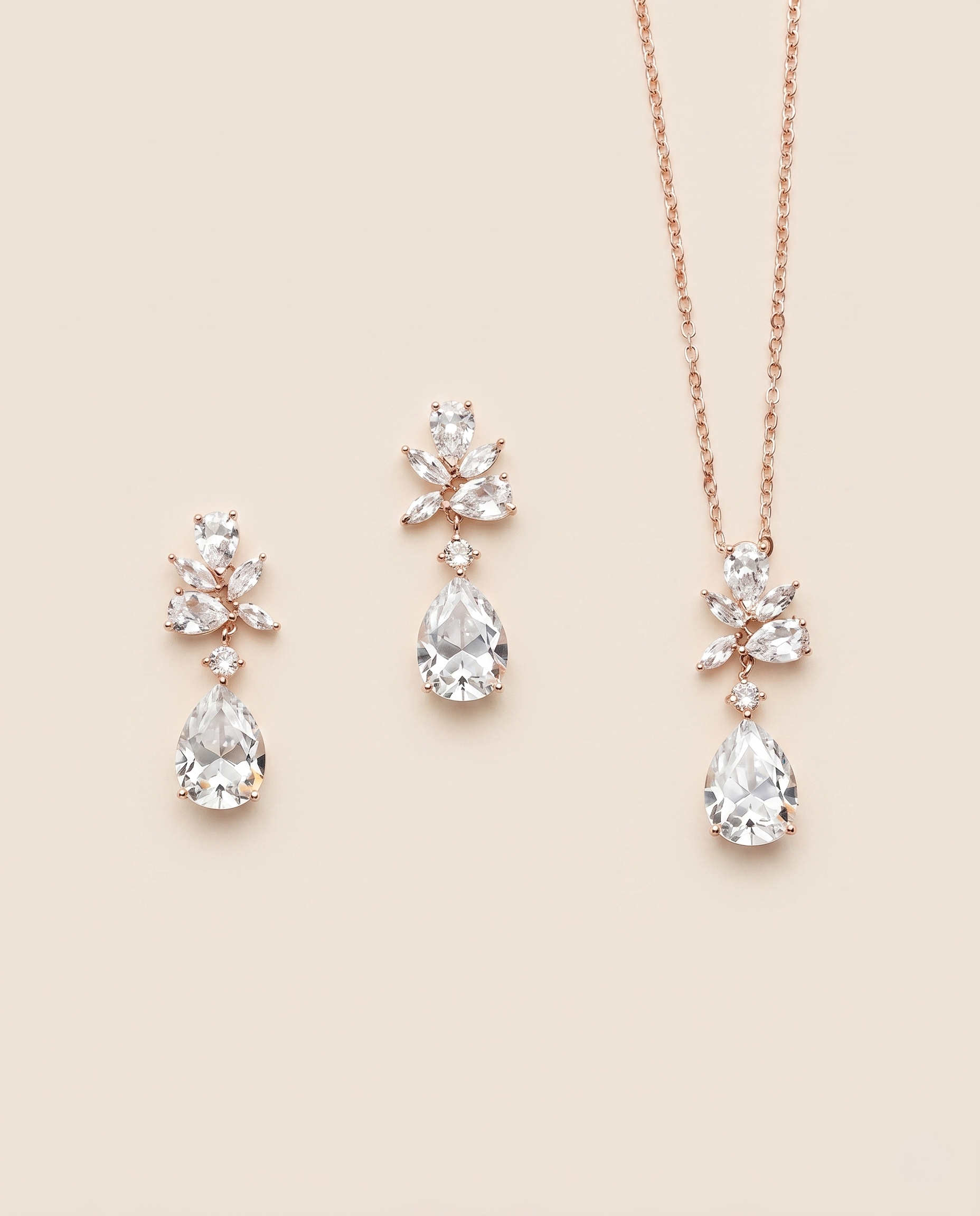a set of elegant jewelry pieces, including a necklace and earrings, all featuring large, clear gemstones.