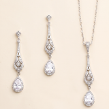 A set of elegant jewelry pieces, including earrings and a necklace, featuring intricate designs and sparkling crystal elements.