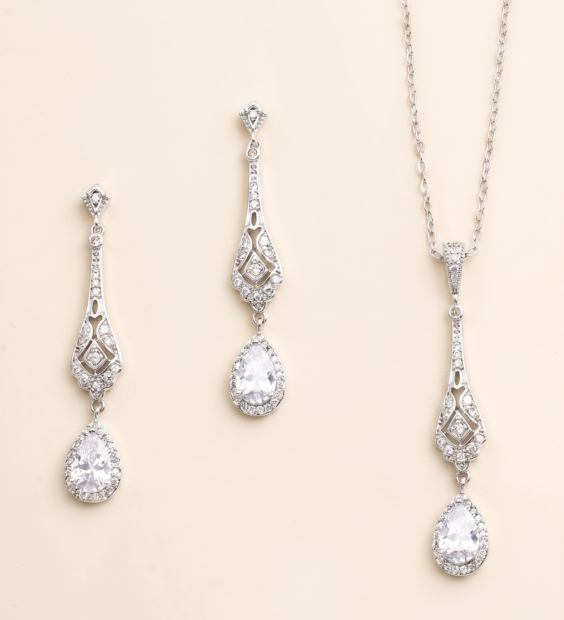 A set of elegant jewelry pieces, including earrings and a necklace, featuring intricate designs and sparkling crystal elements.