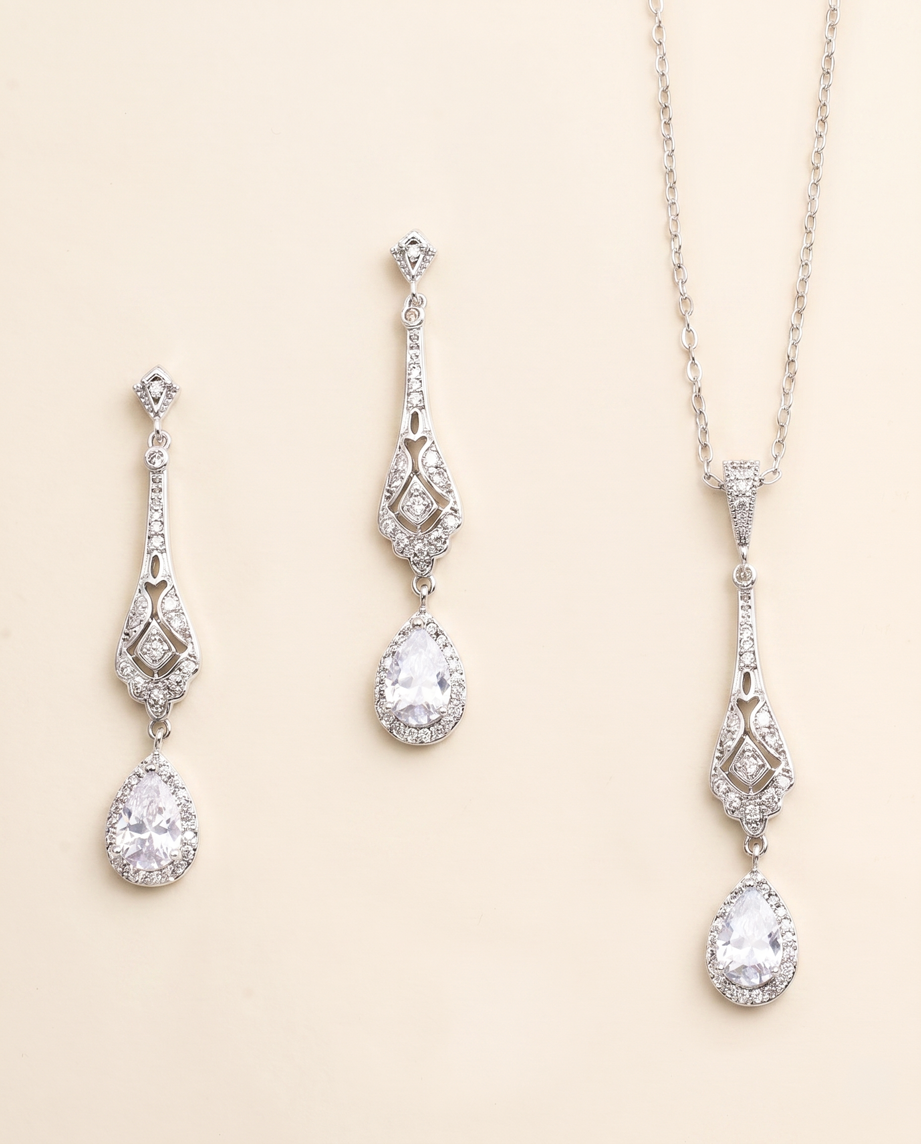 A set of elegant jewelry pieces, including earrings and a necklace, featuring intricate designs and sparkling crystal elements.