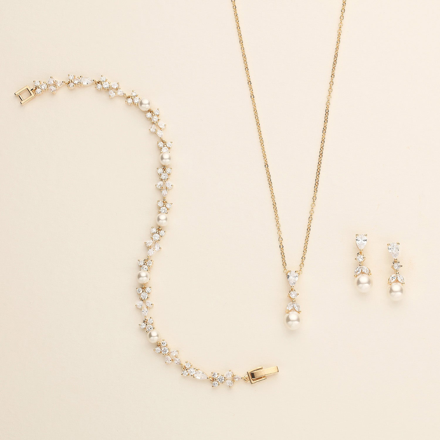 a necklace and earring set with pearls