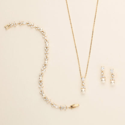 a necklace and earring set with pearls