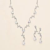 a collection of elegant jewelry pieces, including a necklace, earrings, and a bracelet, all adorned with sparkling diamonds and leaves.
