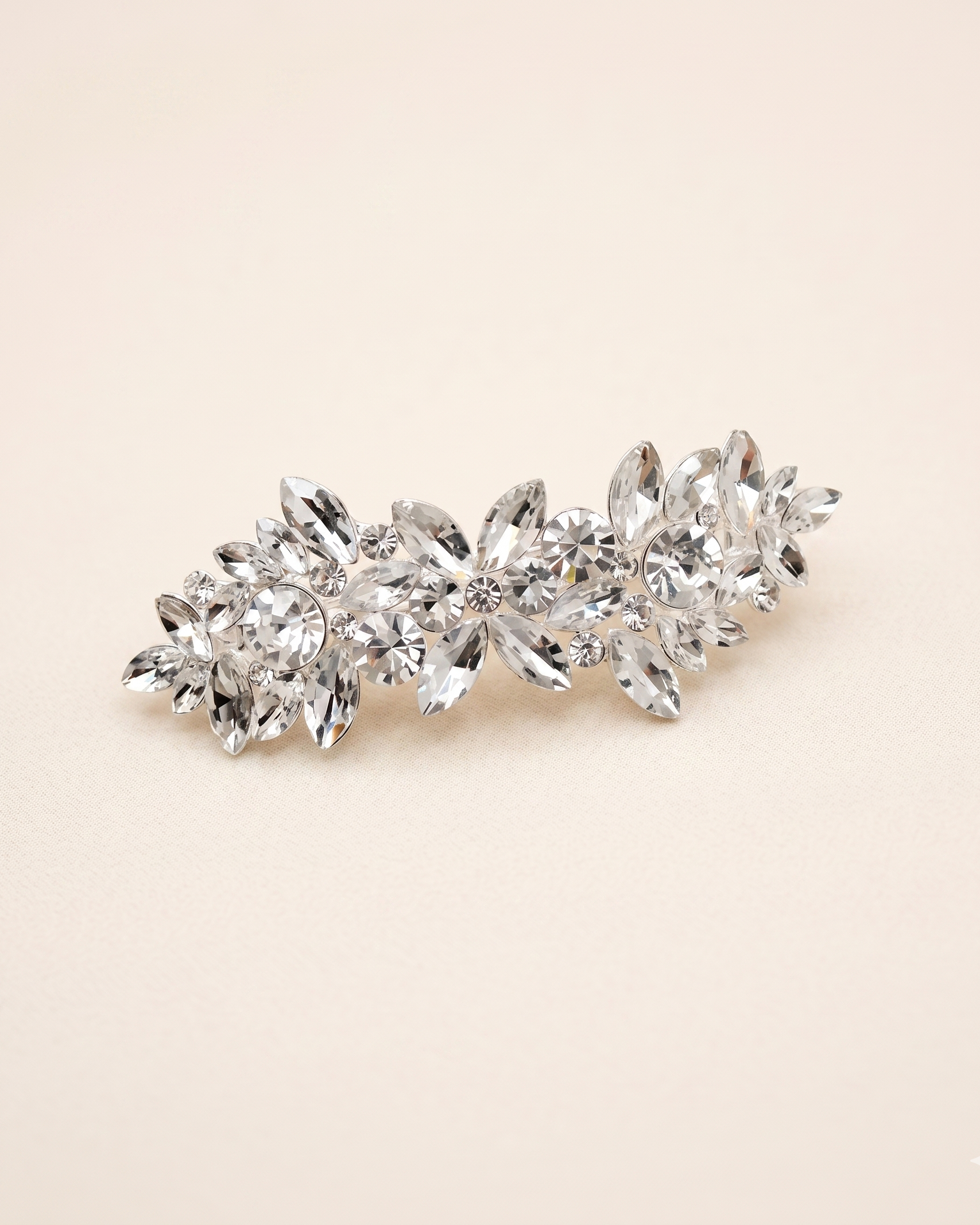 A decorative hair clip made of small, clear, and sparkling crystals.