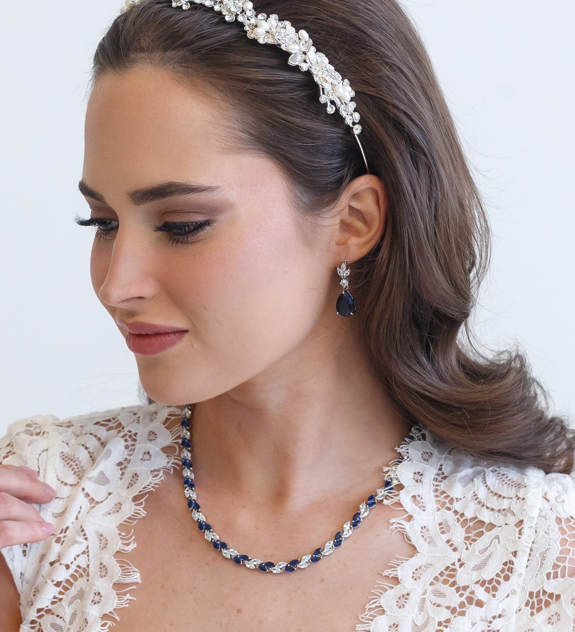a woman wearing a necklace and a headband