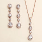 a set of elegant jewelry pieces, including a necklace and earrings, both adorned with large, sparkling diamonds.