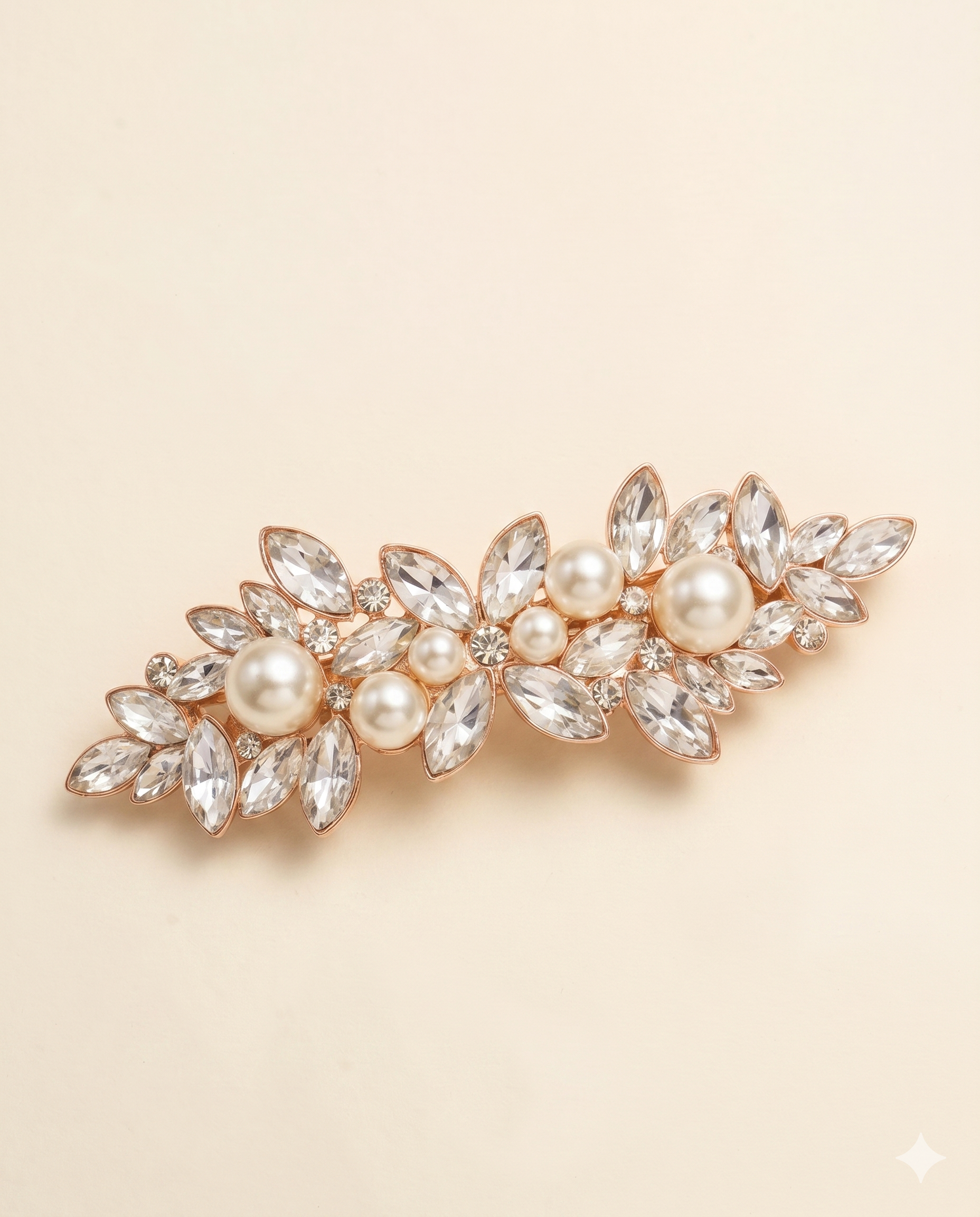 A decorative hair clip adorned with numerous crystal and pearl embellishments.