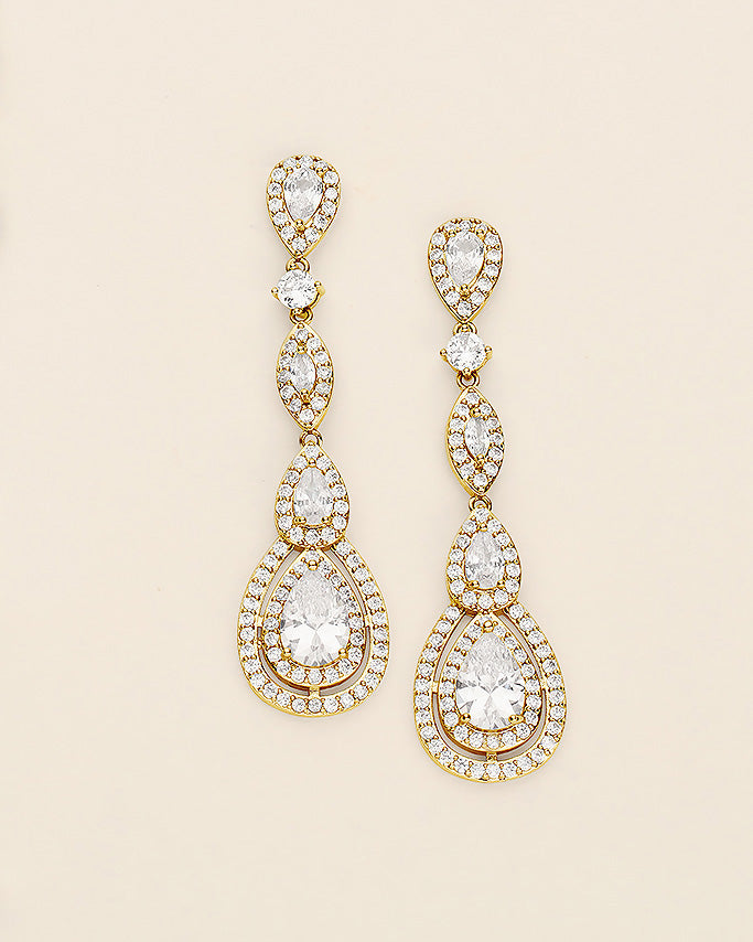 a pair of diamond earrings on a white background