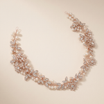A delicate necklace with a floral design and sparkling rhinestones.